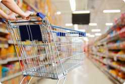 Supermarket aisle with shopping cart